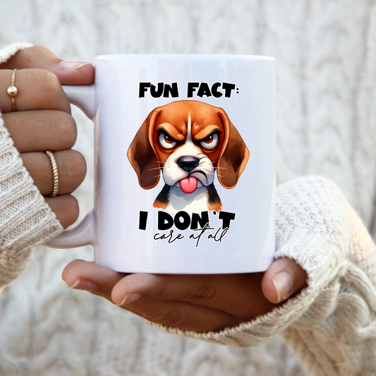 11 oz ceramic mug with a cute cartoon dog   with tongue out and quote Fun Fact, I Dont Care at all. 