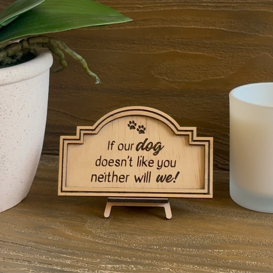 Cute Miniature Pine Plywood sign with easel stand featuring a laser engraved quote "If our dog doesn't llike you neither will we" Approx 6cm High and 10cm Wide. 